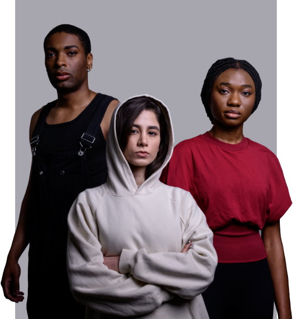 three young people standing in front of a gray background